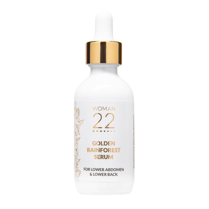 Woman 22 Golden Rainforest Serum in a white glass dropper bottle with gold accents – all-natural botanical serum for women's menstrual wellness and comfort