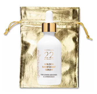 Woman 22 Golden Rainforest Serum elegantly packaged in a reusable gold drawstring pouch – perfect for travel and daily menstrual self-care